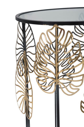 Table ronde Foglie structure métal noir plateau verre décorations dorées