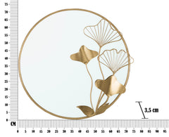 Miroir mural rond doré avec décoration florale