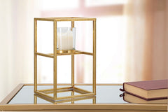 Bougeoir en métal doré avec verre carré