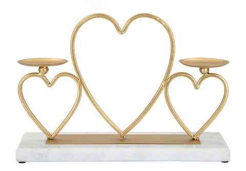 Candelabro de metal dorado con base de mármol blanco y corazones