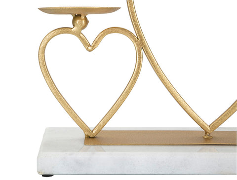 Candelabro de metal dorado con base de mármol blanco y corazones