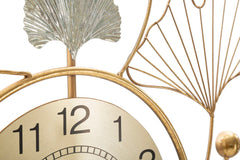 Horloge murale décorative avec feuilles et motifs abstraits