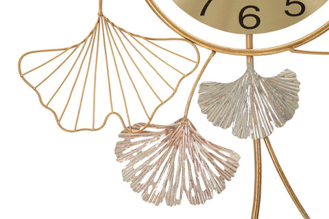 Horloge murale décorative avec feuilles et motifs abstraits