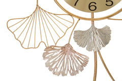 Horloge murale décorative avec feuilles et motifs abstraits