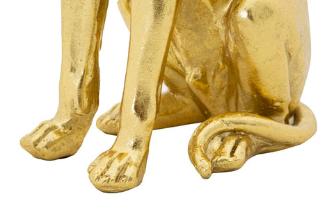 Estatua de perro sentado en oro con corona