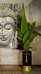 Vase tribal visage stylisé noir doré