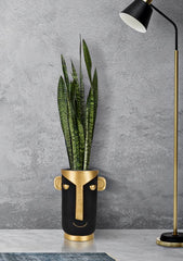 Vase visage stylisé noir et doré