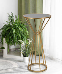 Table ronde métallique dorée avec dessus en verre miroir