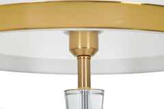 Lampe de sol en métal doré abat-jour en tissu blanc bordures dorées décor transparent