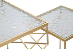 Table carrée en métal doré dessus en verre
