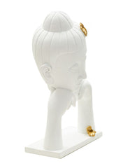 Tête de Bouddha décorée feuilles dorées