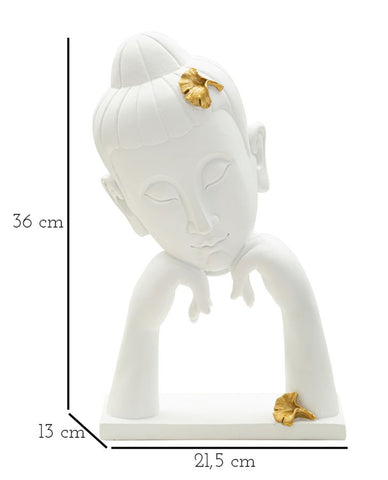 Cabeza de Buda decorada con hojas doradas