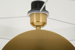 Lampe de sol géométrique métal doré abat-jour tissu blanc bord doré