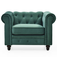 Fauteuil en velours vert capitonné