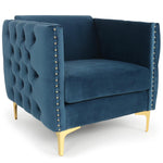 Fauteuil en velours bleu capitonné avec pieds en métal doré