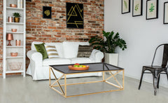 Table basse en verre fumé et pieds or Amelini