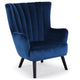 Fauteuil en velours bleu avec dossier matelassé